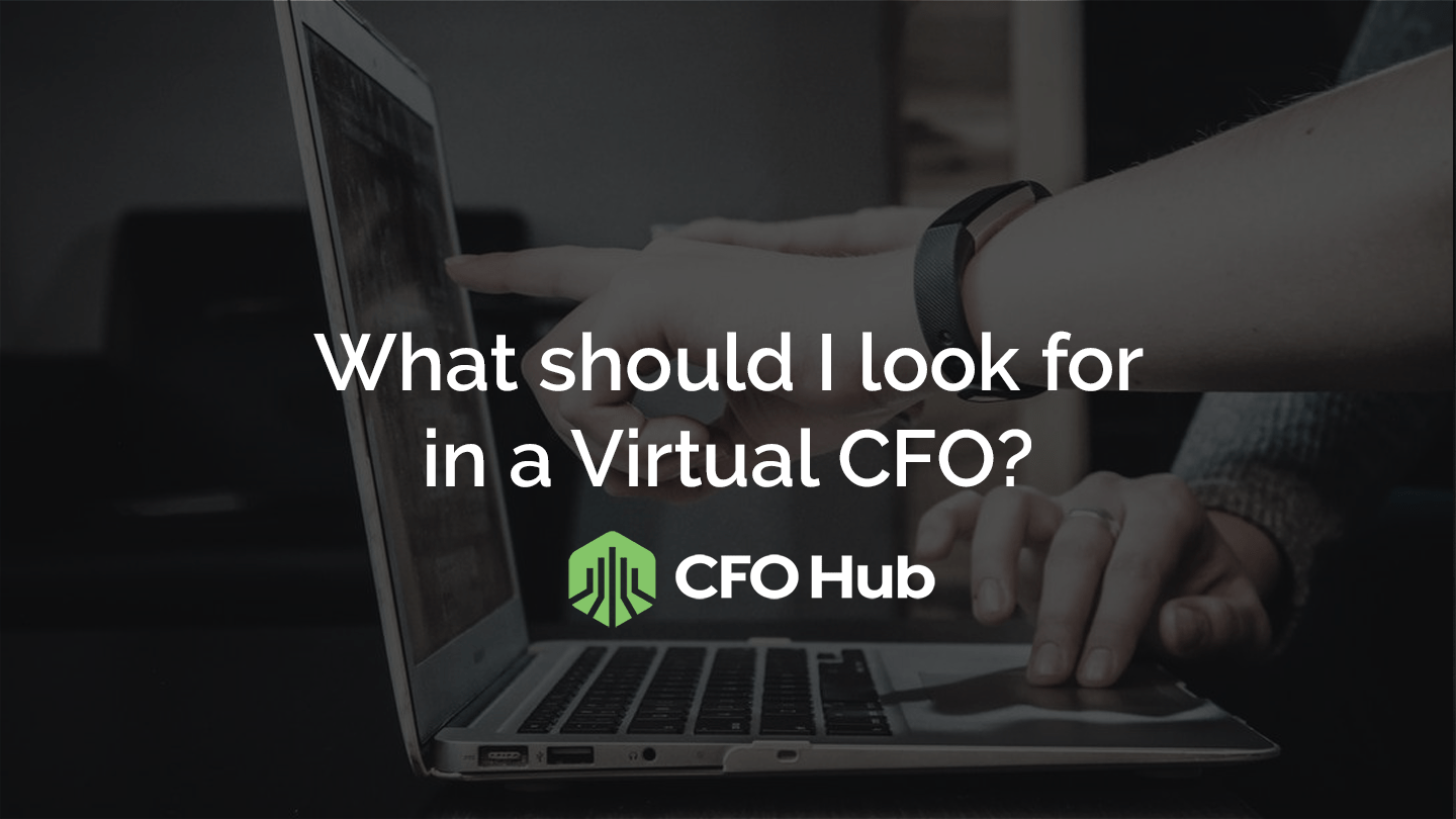 A close-up of two hands working on a laptop, with the text "What important factors should I look for in a Virtual CFO?" overlaid on the image. Below the text is a green logo resembling a building next to the words "CFO Hub.