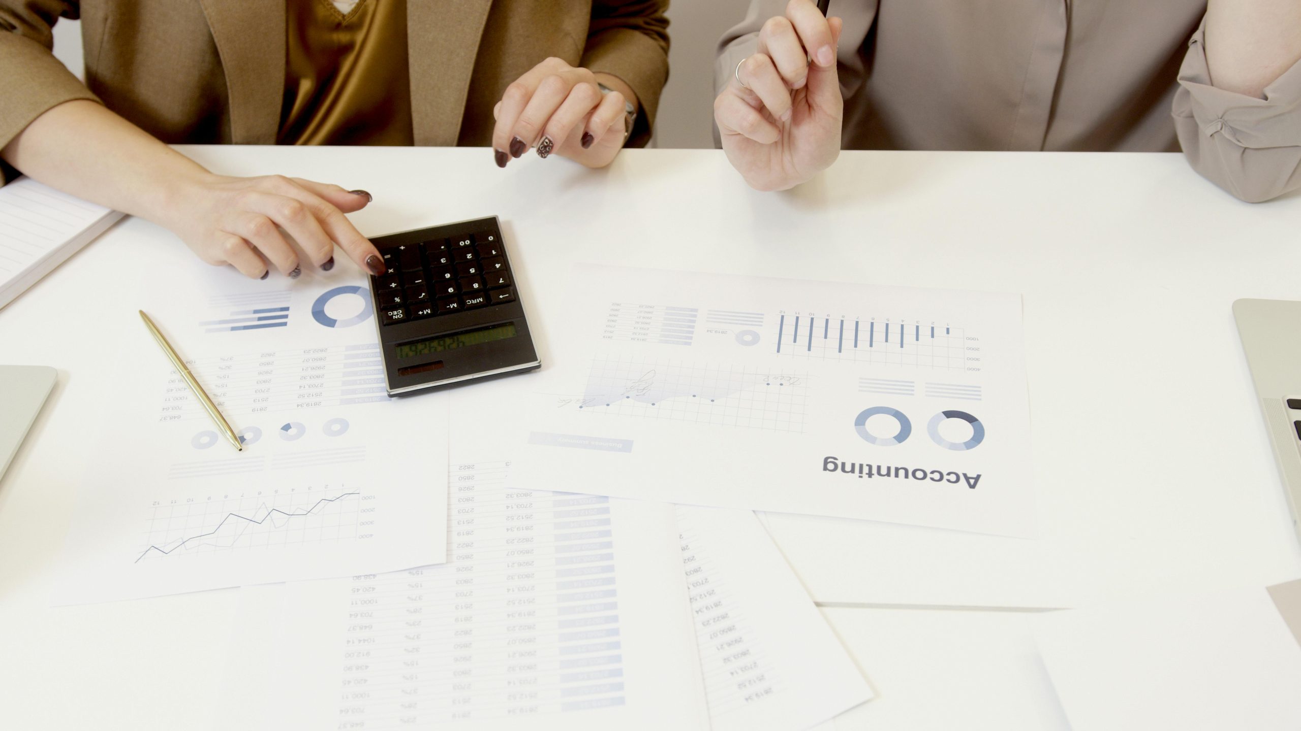 2 people discussing about financial plans for their business