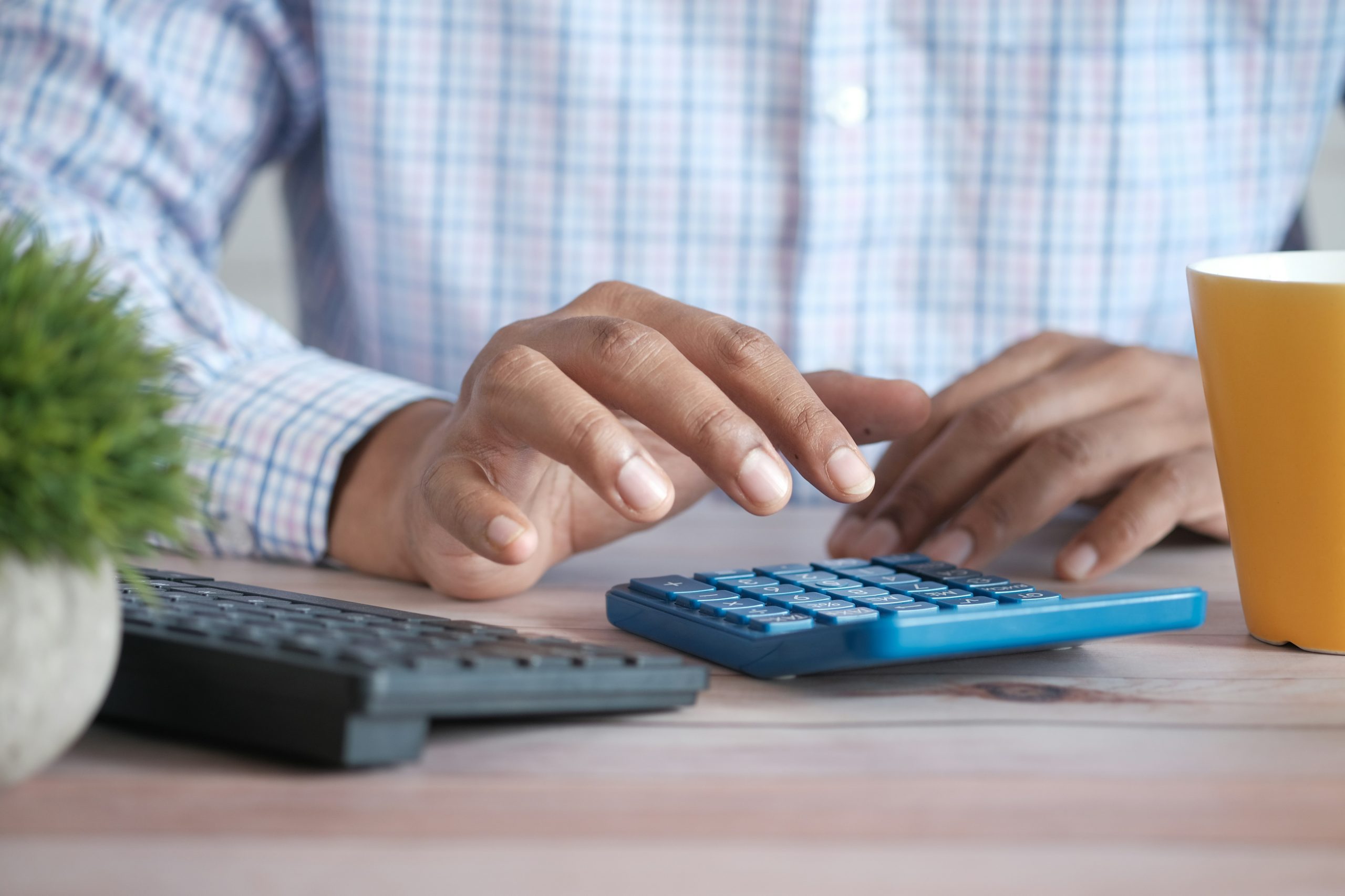 Hand using a calculator