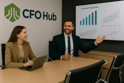 CFOs Presenting In A Boardroom with CFO Hub logo on the wall and financial dashboards on the screen
